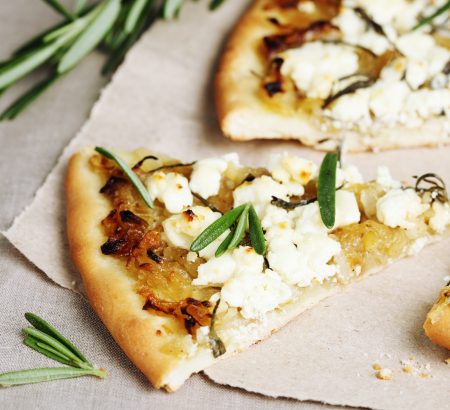 Delicious pizza with feta cheese, tomato, olive oil and thyme