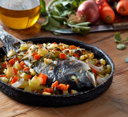 Sea breams in the oven with vegetables